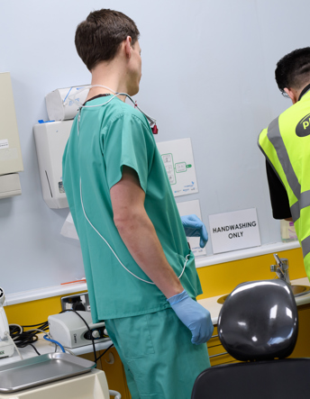 Collection of a sharps bin in a healthcare service